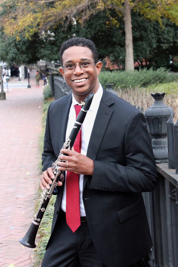 Dr. Ricardo Ferreira holding a clarinet